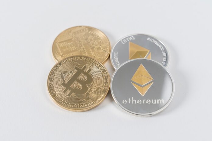 Photo by Thought Catalog four round silver-colored and gold-colored Bitcoins
