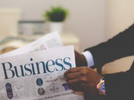How To Choose a Forex Broker: Everything You Need to Know person wearing suit reading business newspaper