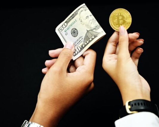 How to Define Bitcoin Characteristics? person holding 20 us dollar bill