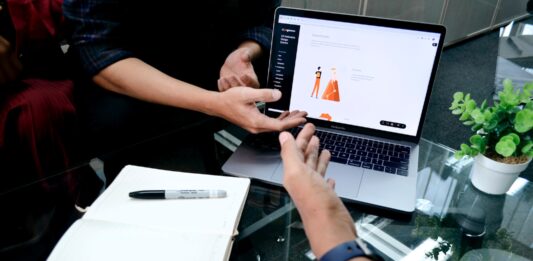 What To Look for When Choosing A Merchant Service Provider person using macbook pro on white table