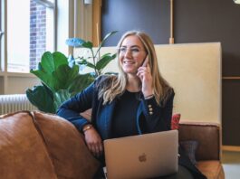 The Role of AI in Recruiting and Hiring woman in blue long sleeve shirt using silver macbook