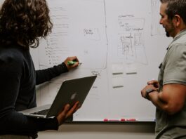 7 Ways Reverse ETL Can Improve Your Insights man wearing gray polo shirt beside dry-erase board