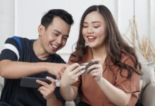 How event catering trends are evolving, and how can online games create a team-building scenario? man and woman siting on sofa chair inside room