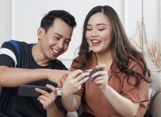 How event catering trends are evolving, and how can online games create a team-building scenario? man and woman siting on sofa chair inside room