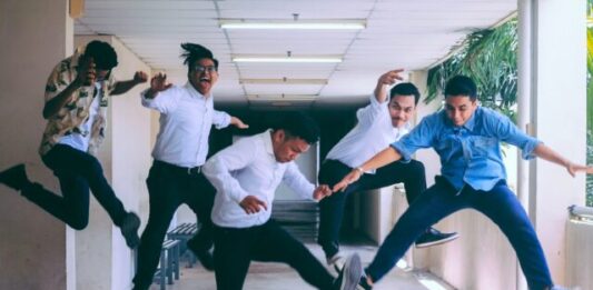 How to Improve Employee Experience group of people doing jump shot photography