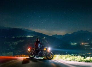 Tips for Maintaining Your Motorcycle man siting on motorcycle at night