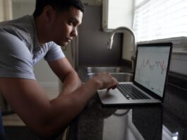 Things to Consider Before Investing in ULIP Plan Online man in gray t-shirt using macbook pro