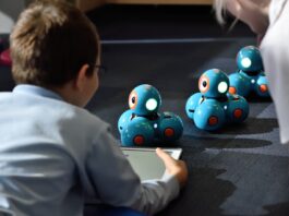 Reasons Your Child Should Take a Robotics Course boy using tablet computer
