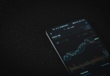 Introduction to the Nasdaq Index black android smartphone on black textile