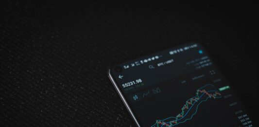 Introduction to the Nasdaq Index black android smartphone on black textile