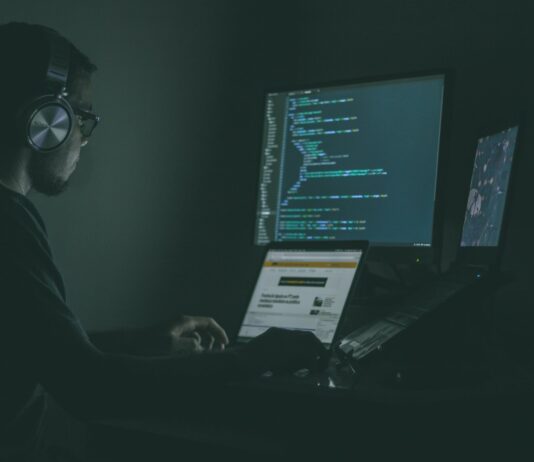 Managed detection and response (MDR) is critical to cybersecurity person using laptop computers