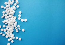 Why Are Drugs Addictive: Understanding the Chemical and Social Side of Things round white pills