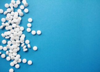 Why Are Drugs Addictive: Understanding the Chemical and Social Side of Things round white pills