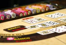Baccarat vs. Blackjack: Differences and Similarities Between the Two Games white red and black game board