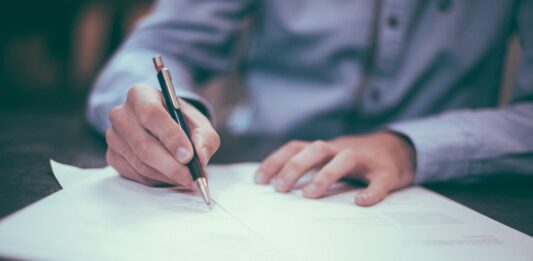 How to Become a Juvenile Criminal Lawyer in New Jersey? man writing on paper
