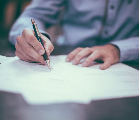 How to Become a Juvenile Criminal Lawyer in New Jersey? man writing on paper