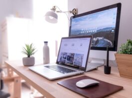 8 Ways to Boost Your PC’s Performance MacBook Pro on table beside white iMac and Magic Mouse
