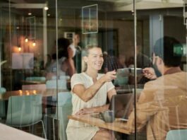 How to Start Correspondence With a Girl? woman in white shirt sitting at coffee shop with man in brown jacket
