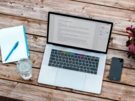 The Most Common Pitfalls When Starting an Online Course or eLearning Platform silver MacBook beside space gray iPhone 6 and clear drinking glass on brown wooden top