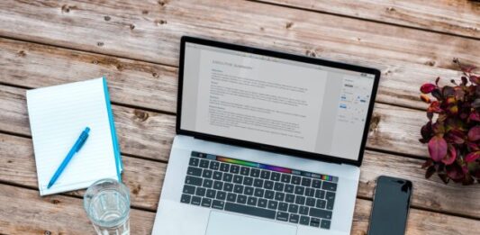 The Most Common Pitfalls When Starting an Online Course or eLearning Platform silver MacBook beside space gray iPhone 6 and clear drinking glass on brown wooden top