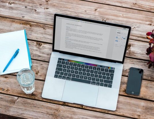 The Most Common Pitfalls When Starting an Online Course or eLearning Platform silver MacBook beside space gray iPhone 6 and clear drinking glass on brown wooden top