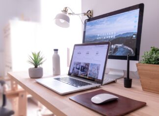 6 Tips to Create a Modern Website for Your Business MacBook Pro on table beside white iMac and Magic Mouse