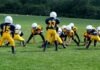 How Sports Leagues Can Implement Cryptocurrency into the Gameday Experience two teams playing football