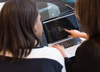 Full Stack Web Development Course – Caltech Two Women Looking at the Code at Laptop