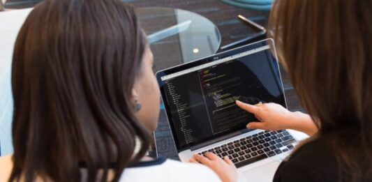 Full Stack Web Development Course – Caltech Two Women Looking at the Code at Laptop