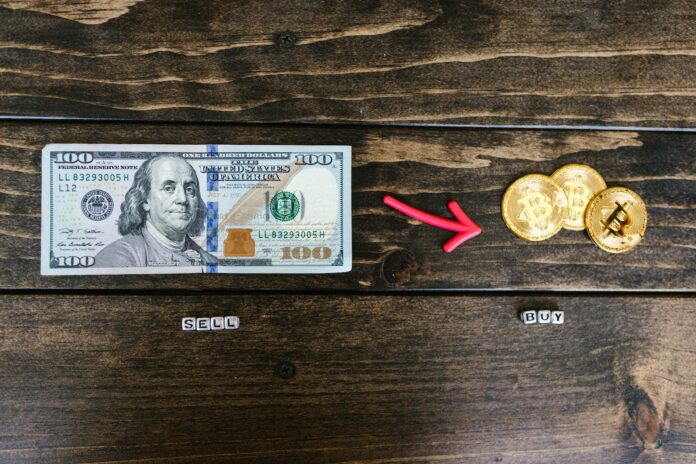 Photo by RODNAE Productions Dollar Bill and Gold Round Coins on Brown Wooden Surface