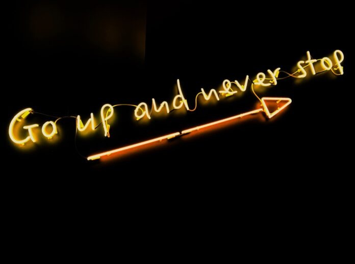 Photo by Fab Lentz black background with yellow text overaly