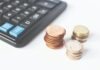 Choosing the Right Payroll Services for Your Business: Factors to Consider Gold-colored Coins Near Calculator