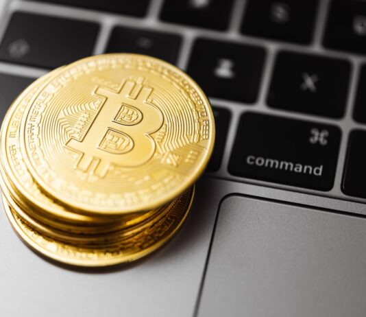 The Fine Art of Bitcoin Trading Success! Stacks Gold Round Coins on Laptop