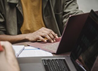 Top 5 Affordable Essay Writing Services to Save Your Money Crop faceless diverse male colleagues working on netbooks in office