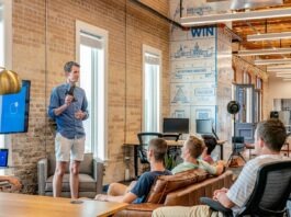 5 Benefits of Team Building Activities man standing in front of group of men