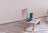 5 Best Ways To Support Your Remote Working Employees macbook pro on white wooden table