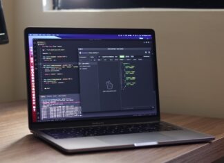 WebRTC API for Safe Video Conferencing a laptop computer sitting on top of a wooden desk
