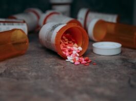 Blue vs. Yellow: What’s the Difference When It Comes to Xanax? a close up of a bottle of pills on a table