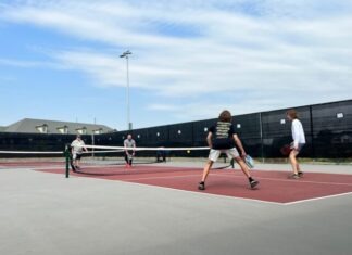 Best Pickleball Clothing Brands for Men & Women a group of people play tennis