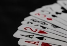 What is Rake in Online Poker, and How Does it Affect Your Winnings? a stack of playing cards sitting on top of each other