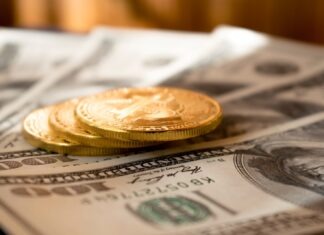 Unlocking Trust: Exploring the Link Between the U.S. Dollar Index and Confidence Coefficients three round gold-colored coins on 100 US dollar banknotes