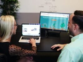 Using HubSpot for Effective Inbound Marketing Strategies man and woman sitting down in front of table
