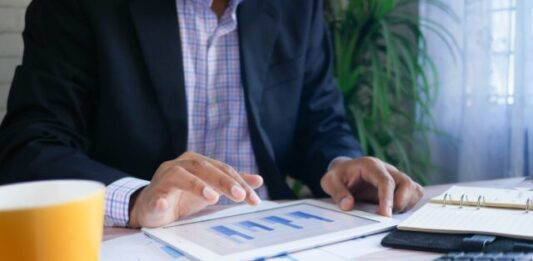 Critical Mistakes to Avoid When Managing Your Business Data person in black suit jacket holding white tablet computer