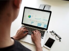 10 Must-Have Tools for New Startups: A Comprehensive Guide to Boost Growth person using MacBook Pro