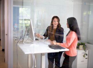 The Art of Customer Intelligence: Harnessing Data to Drive Business Success 2 women sitting at table