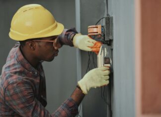 How to Find a Well Rated Electrician? man in brown hat holding black and gray power tool