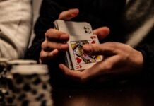 The Case for Playing Low-Stakes Poker person holding king of spade playing card