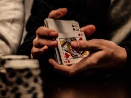 The Case for Playing Low-Stakes Poker person holding king of spade playing card