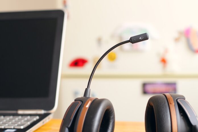 Photo by Petr Macháček black and brown headset near laptop computer