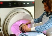 Hiring a Brain Injury Lawyer For The Compensation You Deserve person in blue denim jeans lying on bed